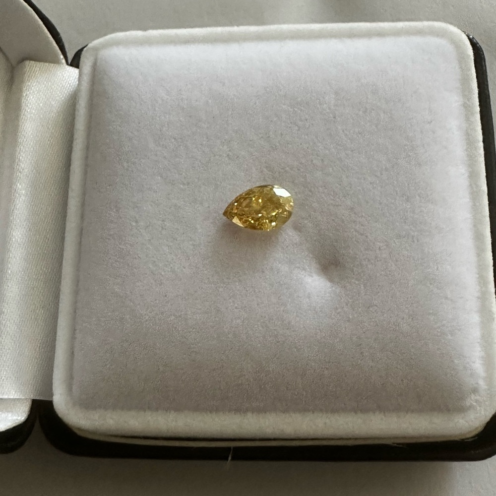 Vivid Yellow Pear Cut IGI certified VVS2 Diamond